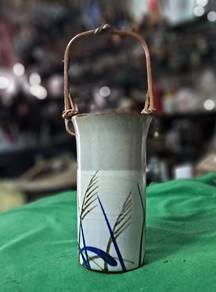 Handcrafted ceramic vase
- Light speckled glaze
- 