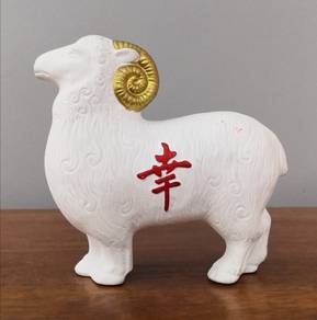 white ceramic sheep golden horns