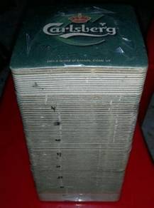 A STACK OF CARLSBERG Coaster