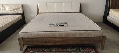 Wooden bed frame with natural wood finish