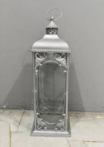 Tall metal candle holder silver colour