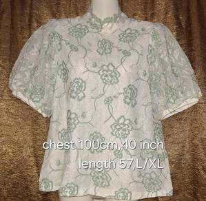 White with a mint green floral lace pattern 