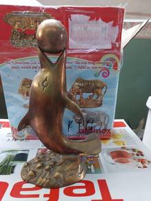 brass statue dolphin