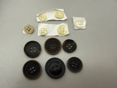 Assorted buttons (Timberland, Nike, Esprit, etc)