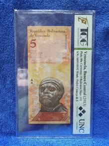 Listing is for a 5 Bolivares banknote from Venezue