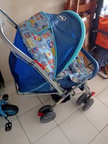 baby cot and stroller