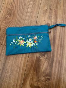 Embroided floral pouch with wrist strap