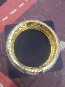 Gold plated bangle with blue stones
