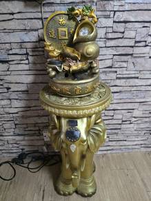 Fountain with golden elephant stand