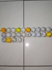 24 used golf balls