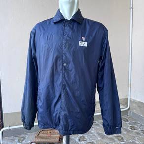 navy blue Tommy Hilfiger nylon coach jacket.