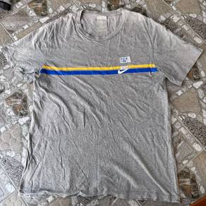 vintage Nike T-shirt with yellow and blue stripes
