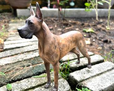 Collection of dog figurines of various breeds