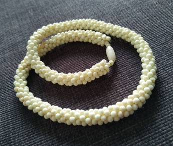 Jewelry necklace made of threads with bone beads