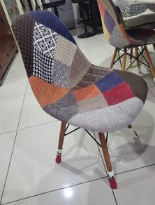 Set (4) of Eames-style patchwork dining chairs.
