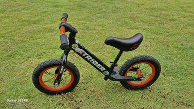 Strider Balance Bike/ Pushbike - Red Wheels