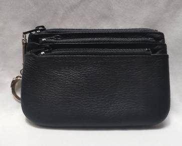 - Black leather coin purse
- 3 zippered compartmen