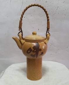 Vintage ceramic teapot with a unique design. It fe