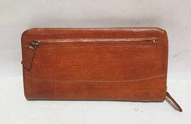 Classic brown leather wallet
- Convenient zip pock