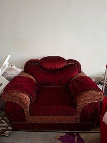 Maroon single seater sofa