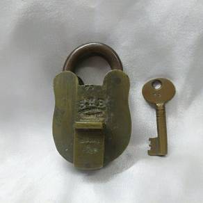 An old or antique brass padlock or lock with key