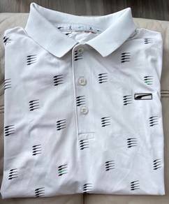 Puma Golf shirt with black and green logo