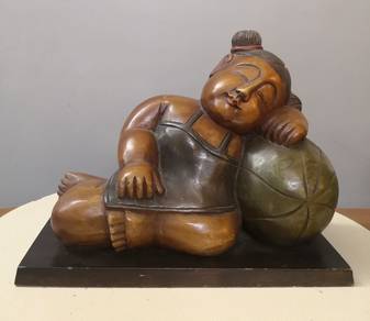 Wooden hand carved oriental bookend