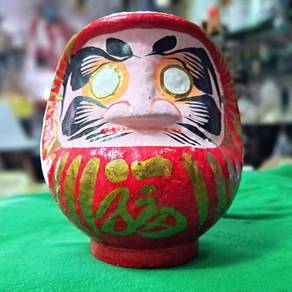 - Traditional Japanese Daruma doll
- Vibrant red b