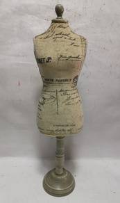 Decorative dress form with a vintage postcard prin