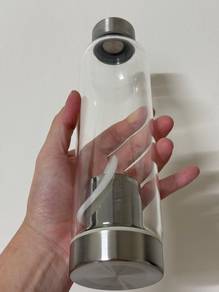 Glass bottle with protective sleeve