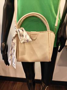 Small used hand bag beige colour
