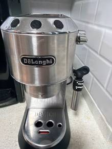 DeLonghi Coffee machine with supplies