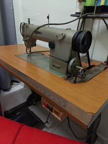 Sewing machine = mesin jahit