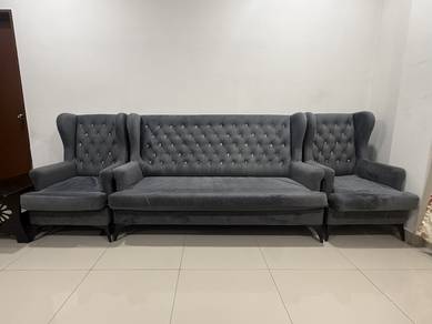 High back chesterfield sofa in grey colour.