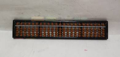 Japanese abacus with wooden beads and a black fram