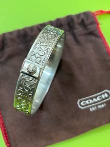 COACH Silver Tone Signature Bangle Bracelet