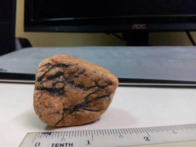 A rare stone shaped like a tiger head, figures,
