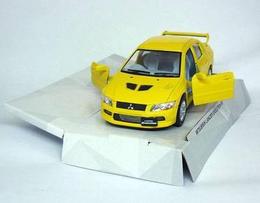 Mitsubishi lancer evolution VII diecast - Yellow