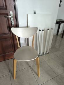 White Wooden Chair and Disassembled Study Table