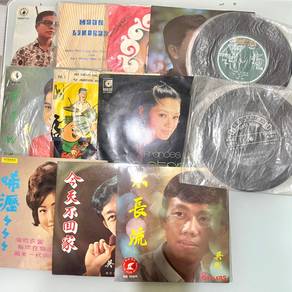 vintage vinyls of 3 sizes and music genre