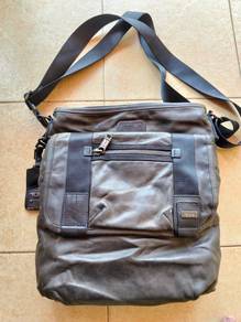 TUMI sling leather