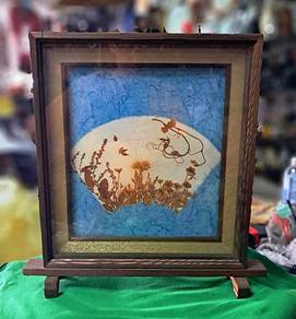 Beautiful framed artwork
- Features dried flowers 