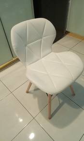Four White leather chairs with wood legs