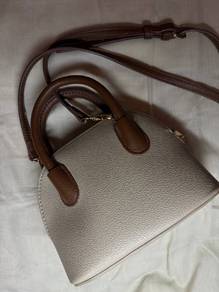 Beige colour sling bags