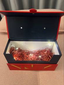 Red gift box with light & shredded paper
