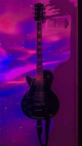 Les Paul electric guitar (left handed) with amp