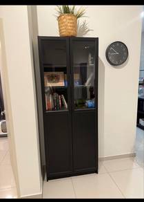 Ikea bookshelf with glass panel