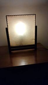 A lovely decorative table lamp featuring a translu