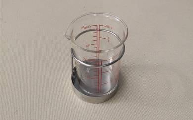 Iwaki Pyrex glass pitcher with metal holder