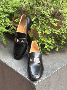 Chanel Black Shiny Calfskin Lettering Logo Loafers